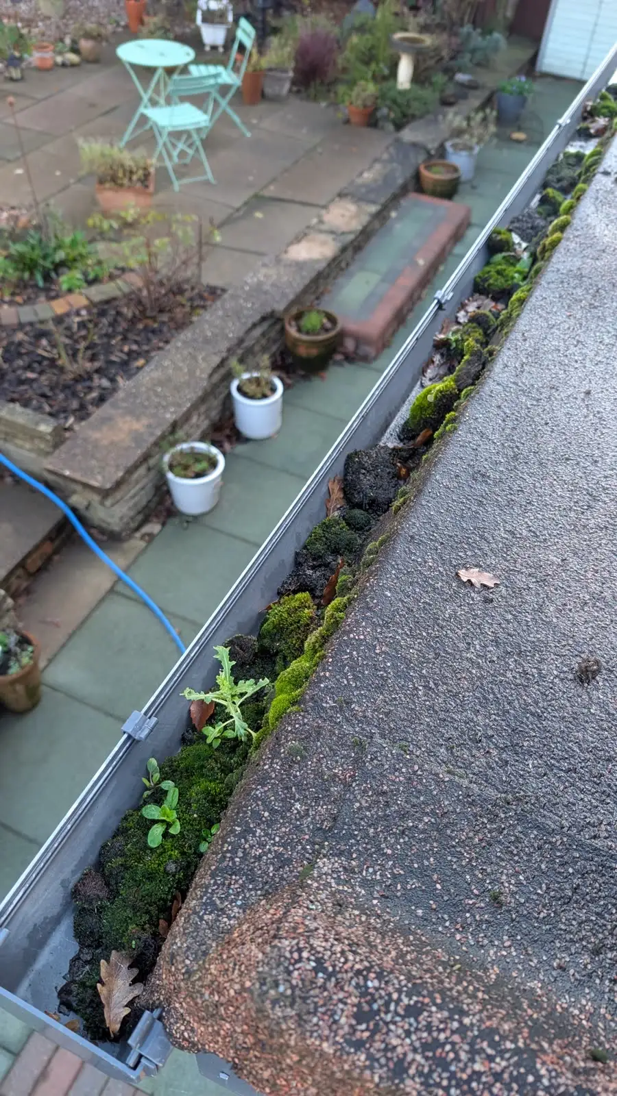 Flat-roof gutter, Islington — before cleaning